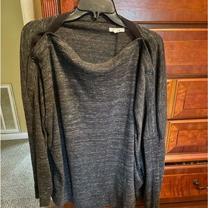 Grey long sleeved top. Buttons around neck. Can hang off shoulder
